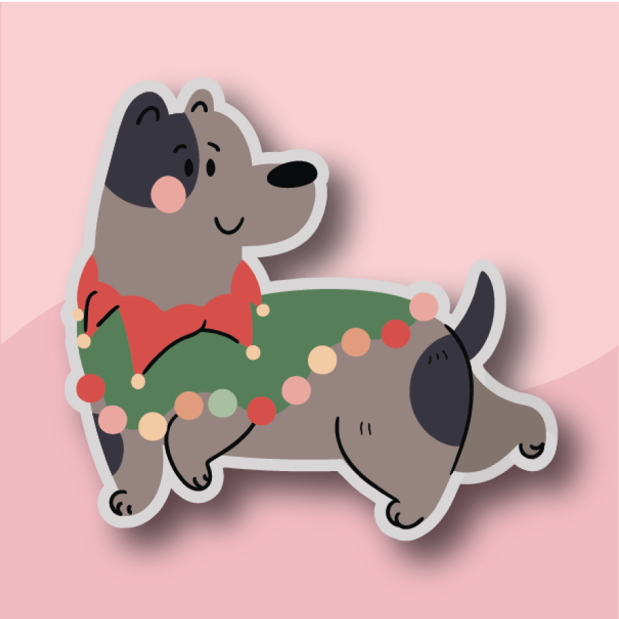 Dalmatian holding a sprig of holly
