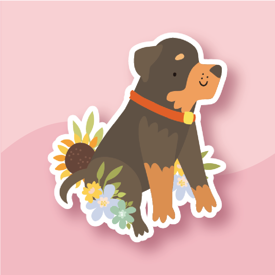 A playful black-and-tan pup with floral decorations
